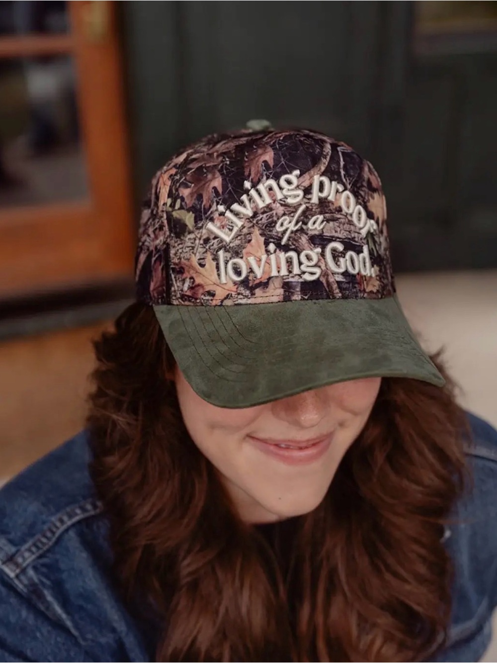 "Living proof of a loving God" Camouflage Baseball Hat with Olive Suede Bill